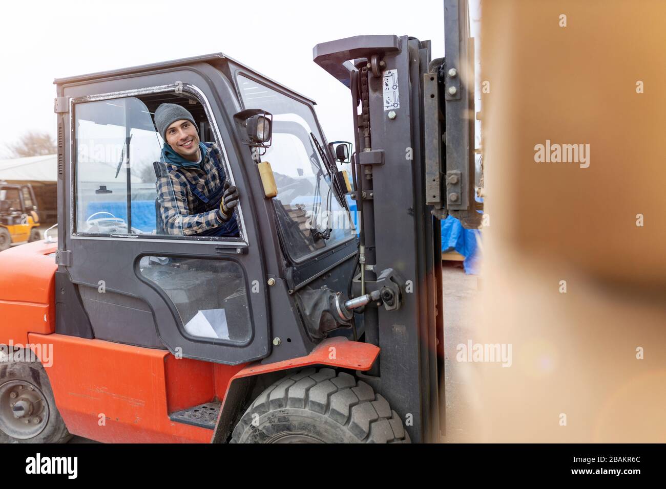 Young male worker in timber warehouse Stock Photo