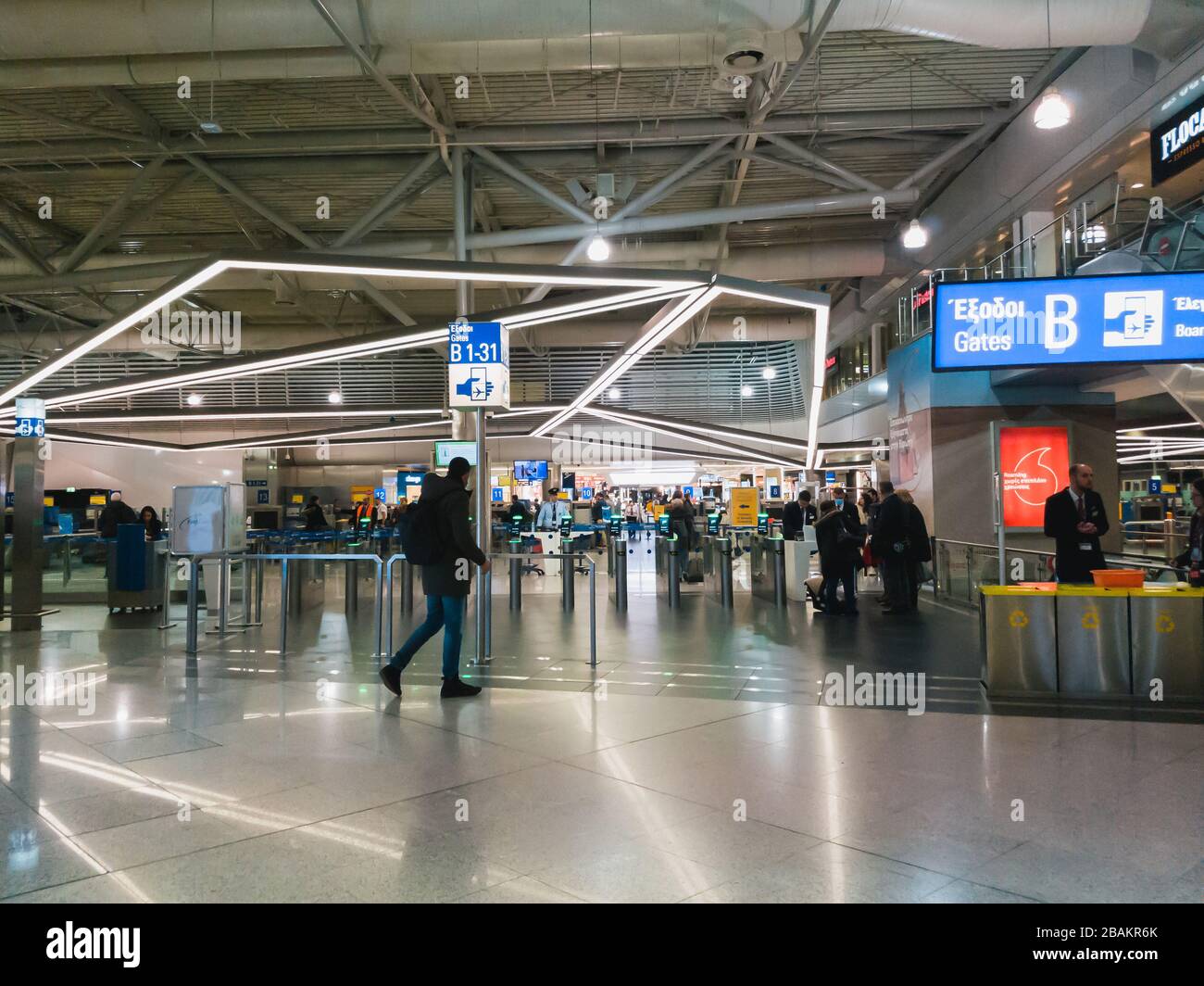 Athens, Greece - February, 11 2020: Passengers in the departure hall of the main terminal going to the gates through the security screening, Athens Stock Photo