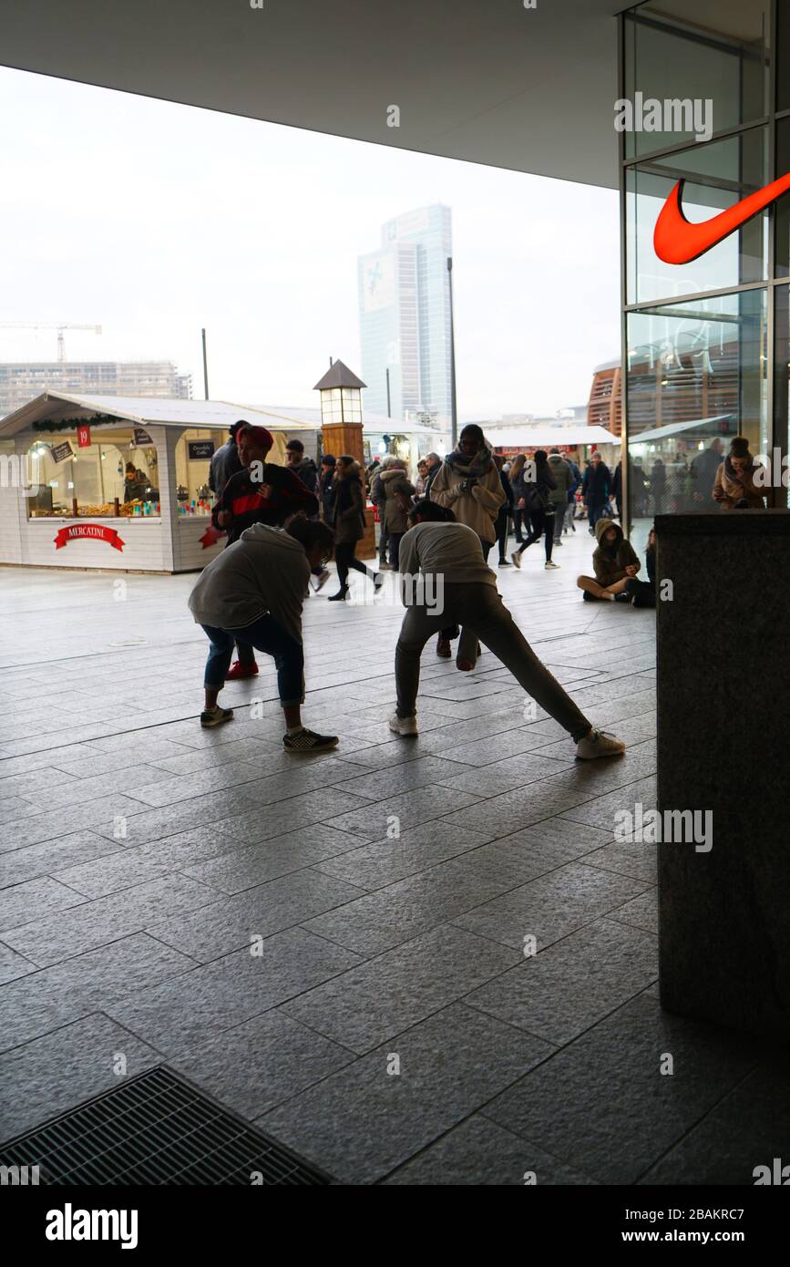 Boys And Girls Try Dance Steps In Piazza Gae Aulenti Square Porta