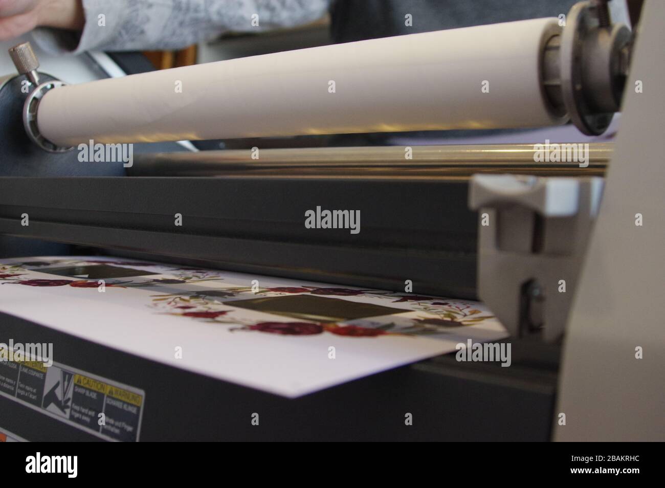 Plastic laminating machine Stock Photo Alamy