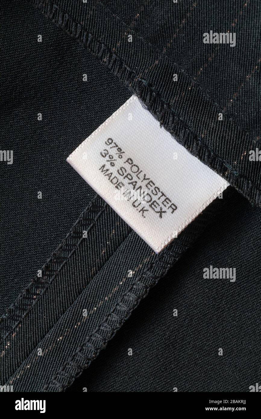 97% polyester 3% spandex label in woman's trousers made in U.K. Stock Photo
