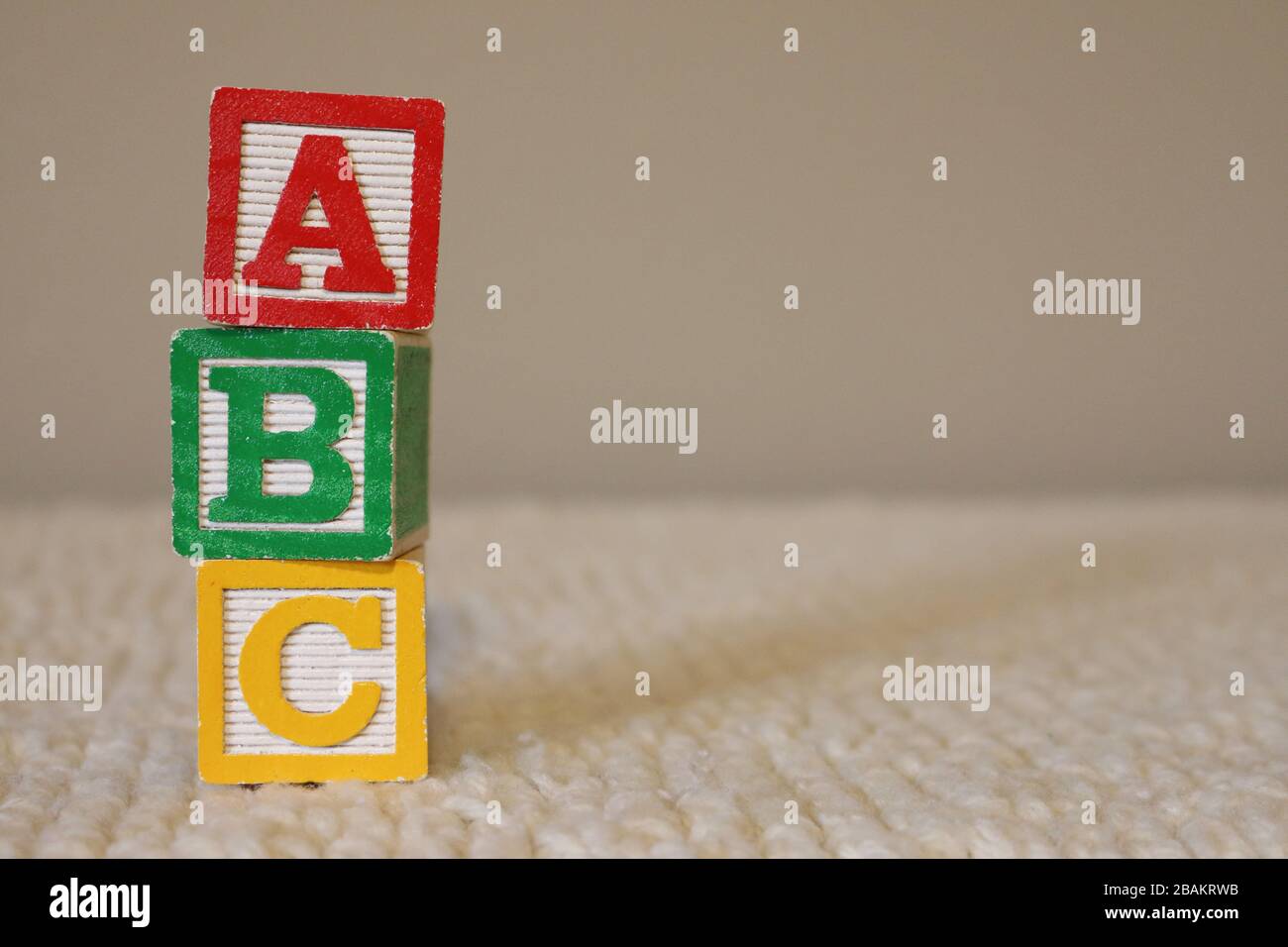 Letter Blocks stacked vertical that spell ABC on soft background Stock
