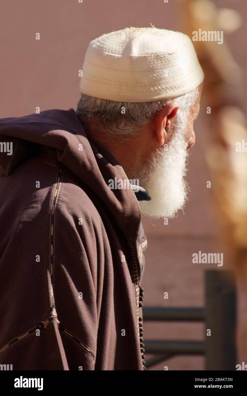 Street-photography of local people in traditional clothing, doing their everyday business. Shots are taken within the Medina in Marrakech, Morocco Stock Photo