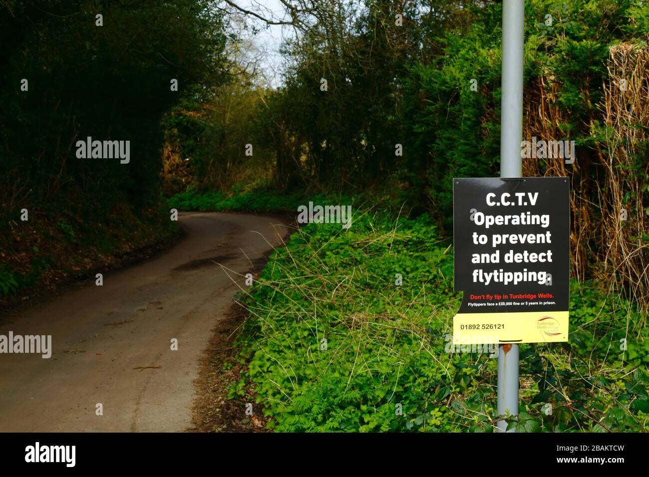 CCTV Operating to Prevent and Detect Flytipping sign on country lane in Weald of Kent near Tunbridge Wells, England Stock Photo