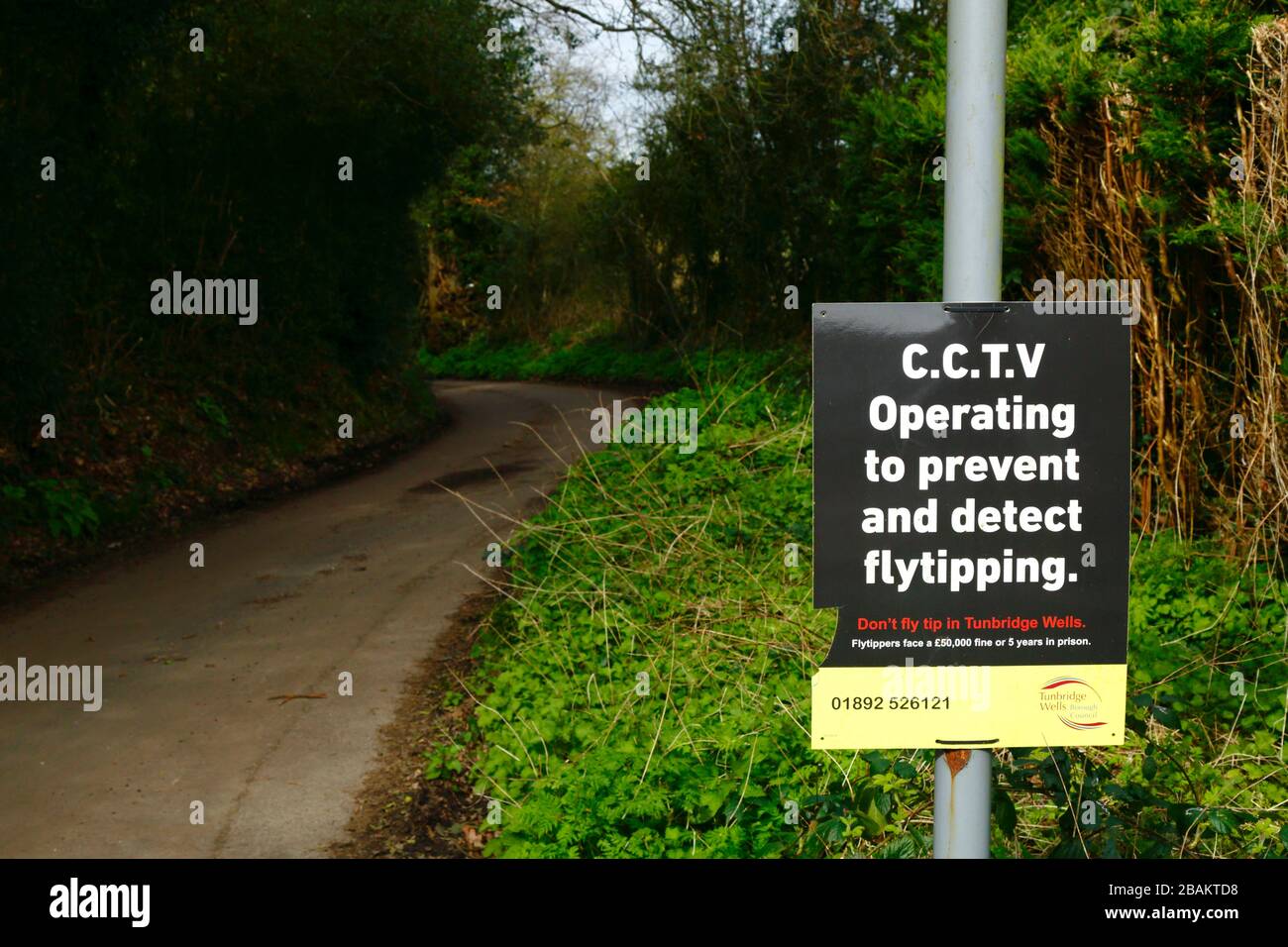 CCTV Operating to Prevent and Detect Flytipping sign on country lane in Weald of Kent near Tunbridge Wells, England Stock Photo