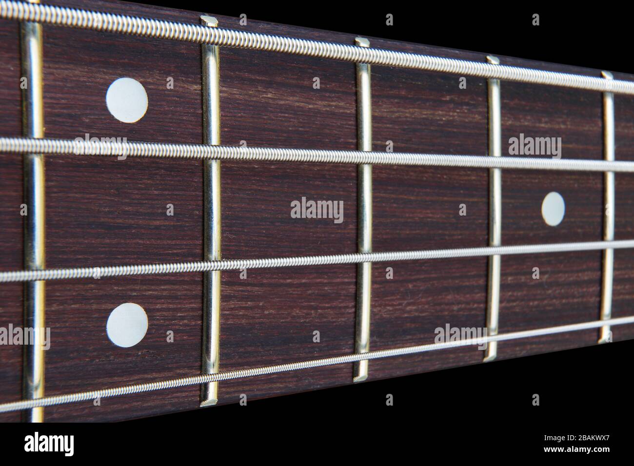Four string bass guitar fretboard neck with selective focus Stock Photo