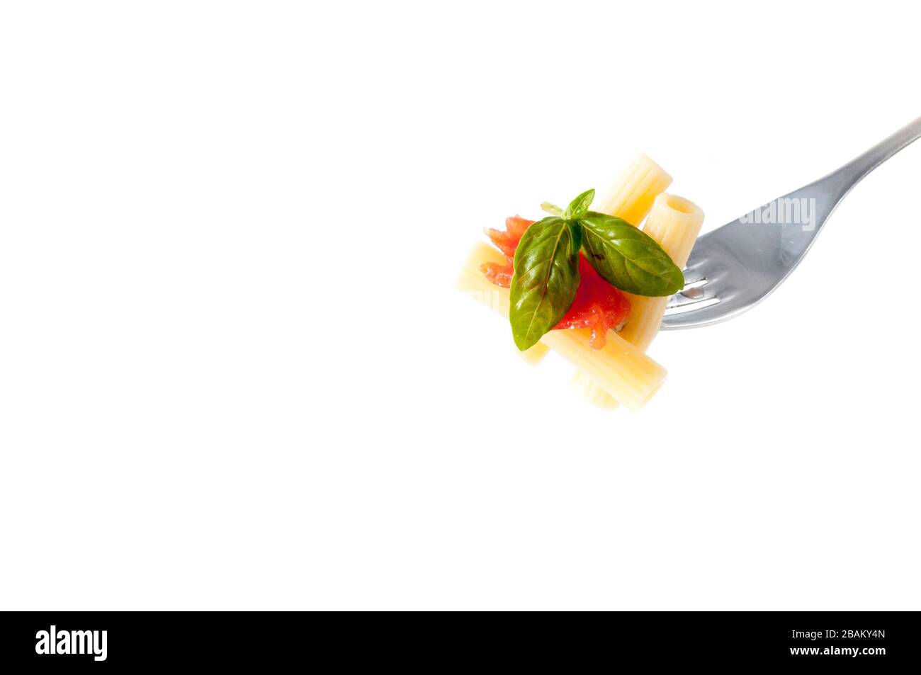 rigatoni pasta with chopped tomatoes, basil, Parmesan cheese and olive oil on a fork Stock Photo