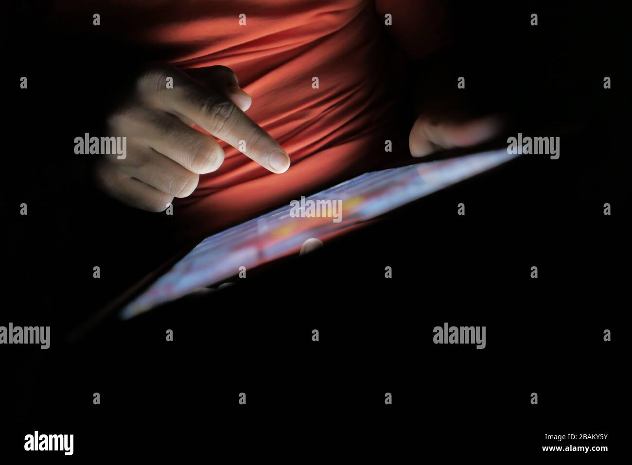 hand presses on screen digital tablet, close up Stock Photo