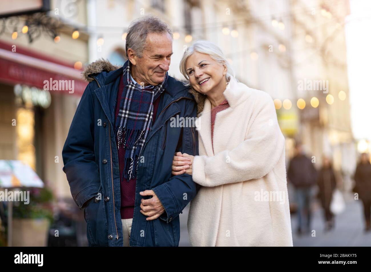 Elderly Couple Having Fun Outdoors At Christmas Time Stock Photo