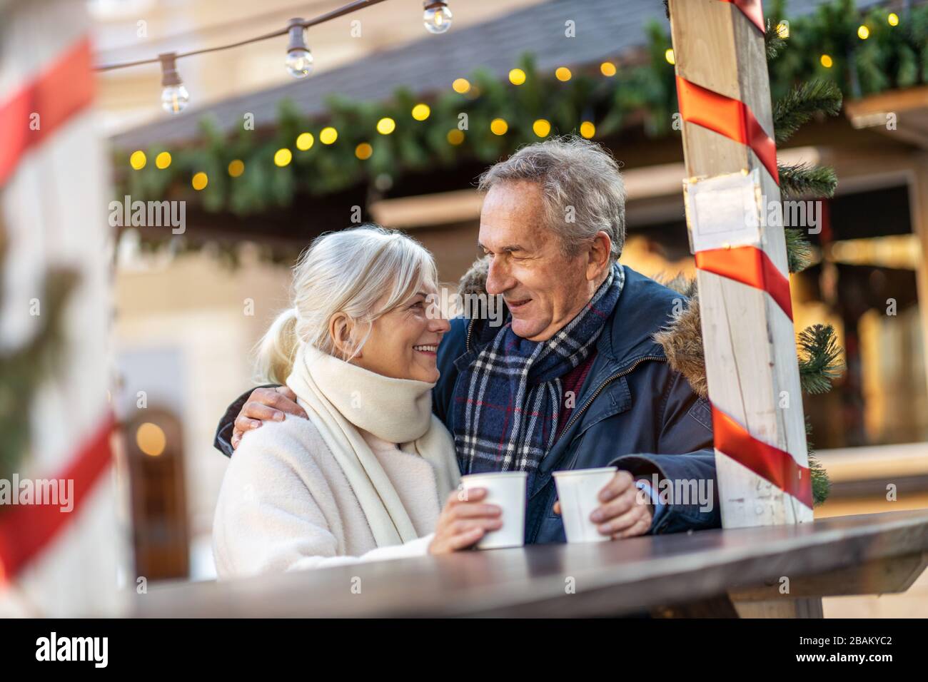 Elderly Couple Having Fun Outdoors At Christmas Time Stock Photo