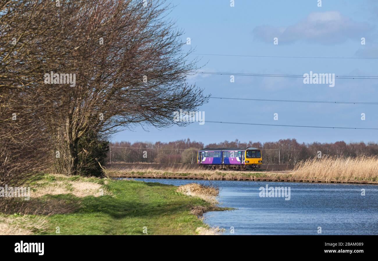 Northern Trains class 144 pacer train 144011 passing Godnow Bridge by the Stainforth and Keadby canal Stock Photo