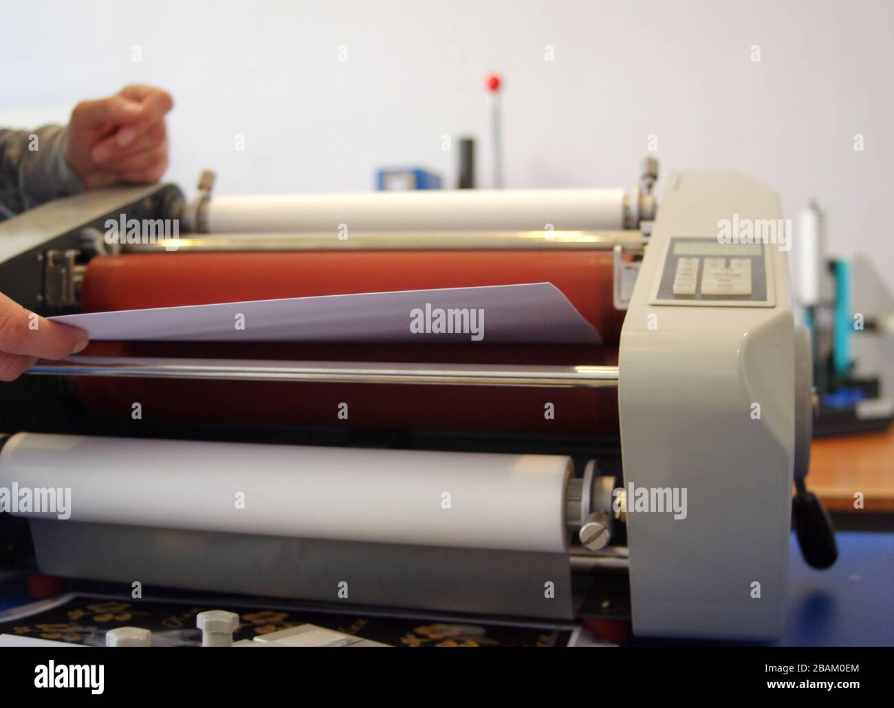 Plastic laminating machine Stock Photo Alamy