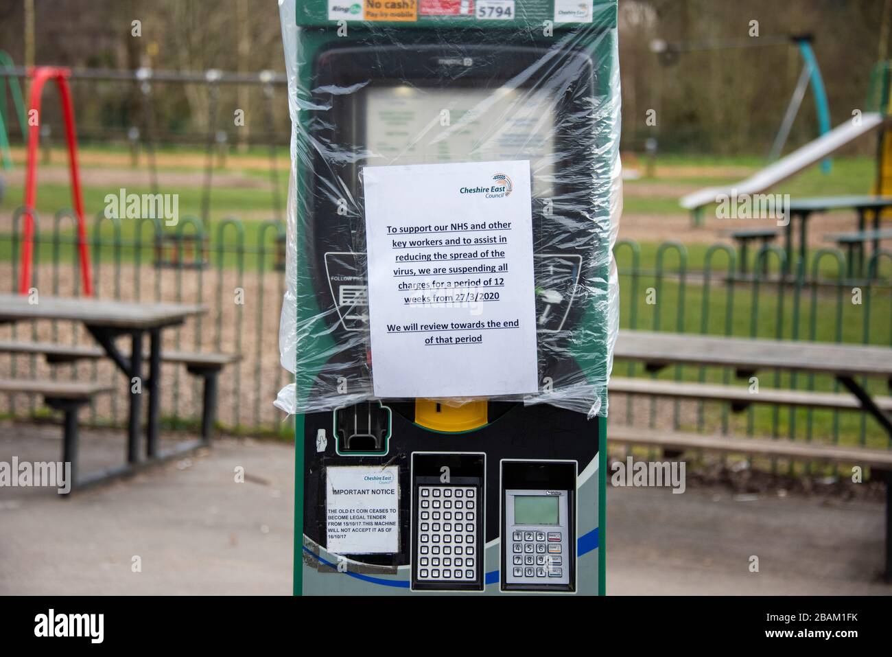 Parking meter in public park in Wilmslow, Cheshire, UK due to Coronavirus lock down on 29.03.20 to aim to reduce the spread of COVID-19 Stock Photo