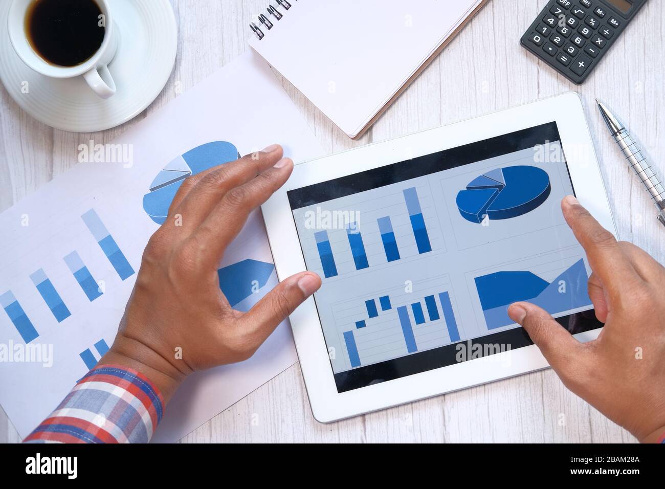 Close up of man hand analyzing chart on digital tablet Stock Photo - Alamy
