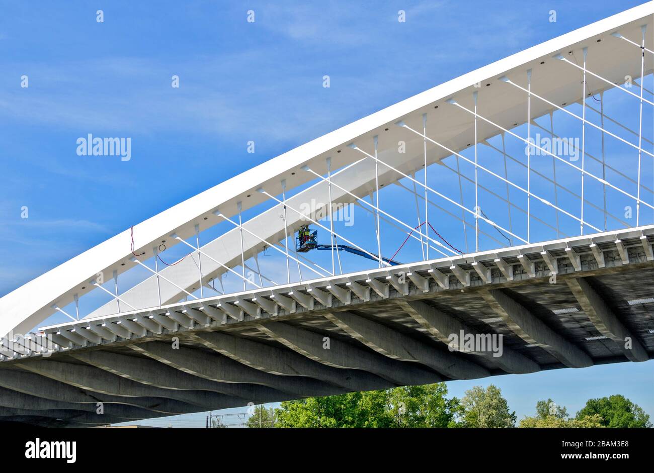 installation work on the new Troja  bowstring arch bridge made from prestressed concrete and steel across the river Vltava at Prague, Czech Republic Stock Photo