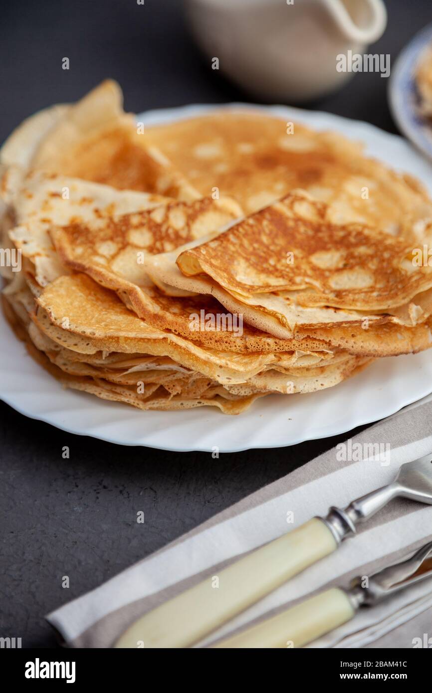 Tasty traditional russian breakfast of slapjack with honey on plate. Rustic  style. Space for your text and top view Stock Photo - Alamy