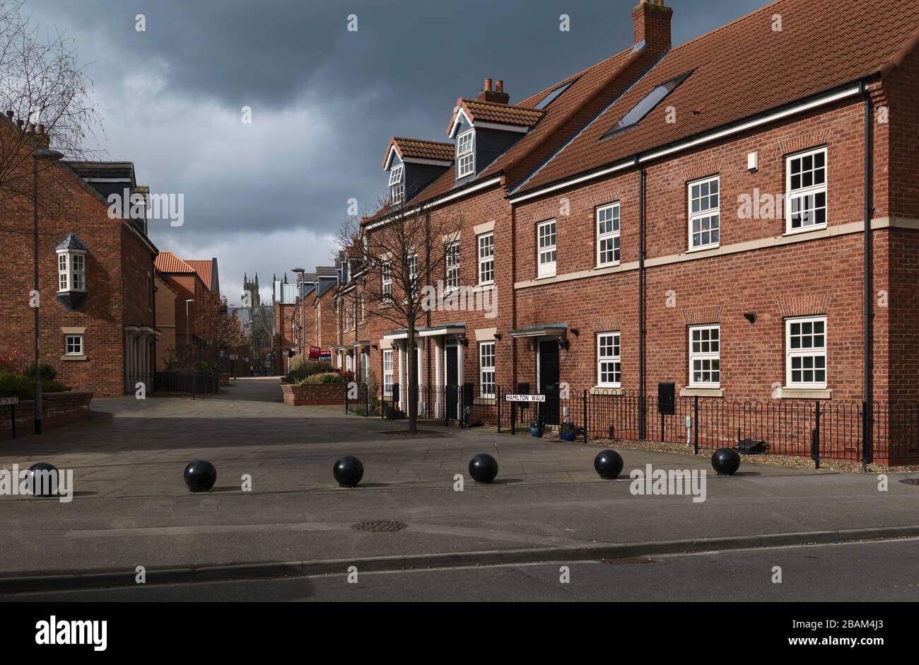 Shopping precinct and town houses completely devoid of people due to outbreak of Corona virus and government restrictions. Beverley, UK. Stock Photo