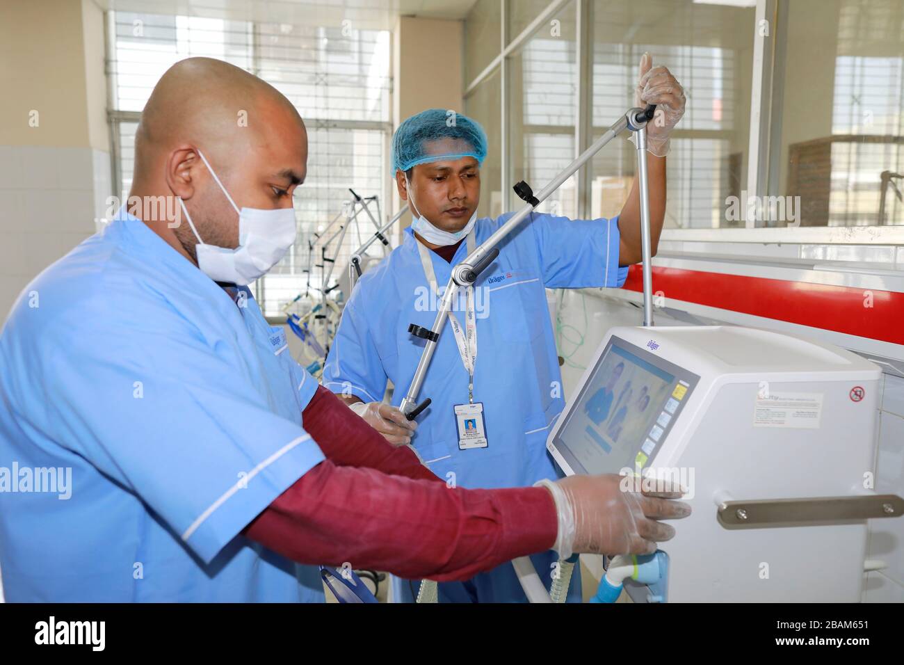 Dhaka, Bangladesh. 28th Mar, 2020. Staffs of medical equipment vendor