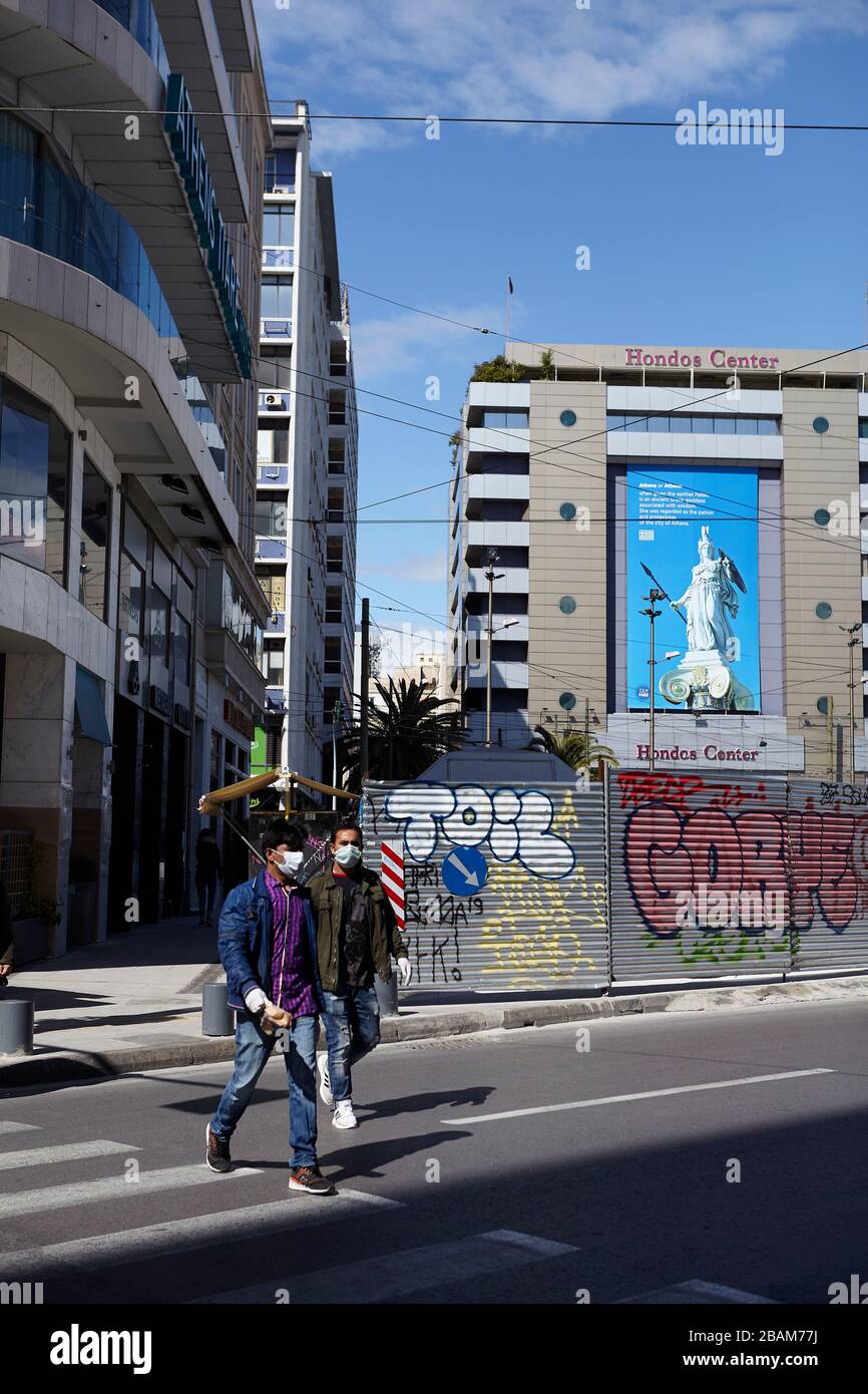 people wearing a protective mask at Omonia Athens greece Stock Photo