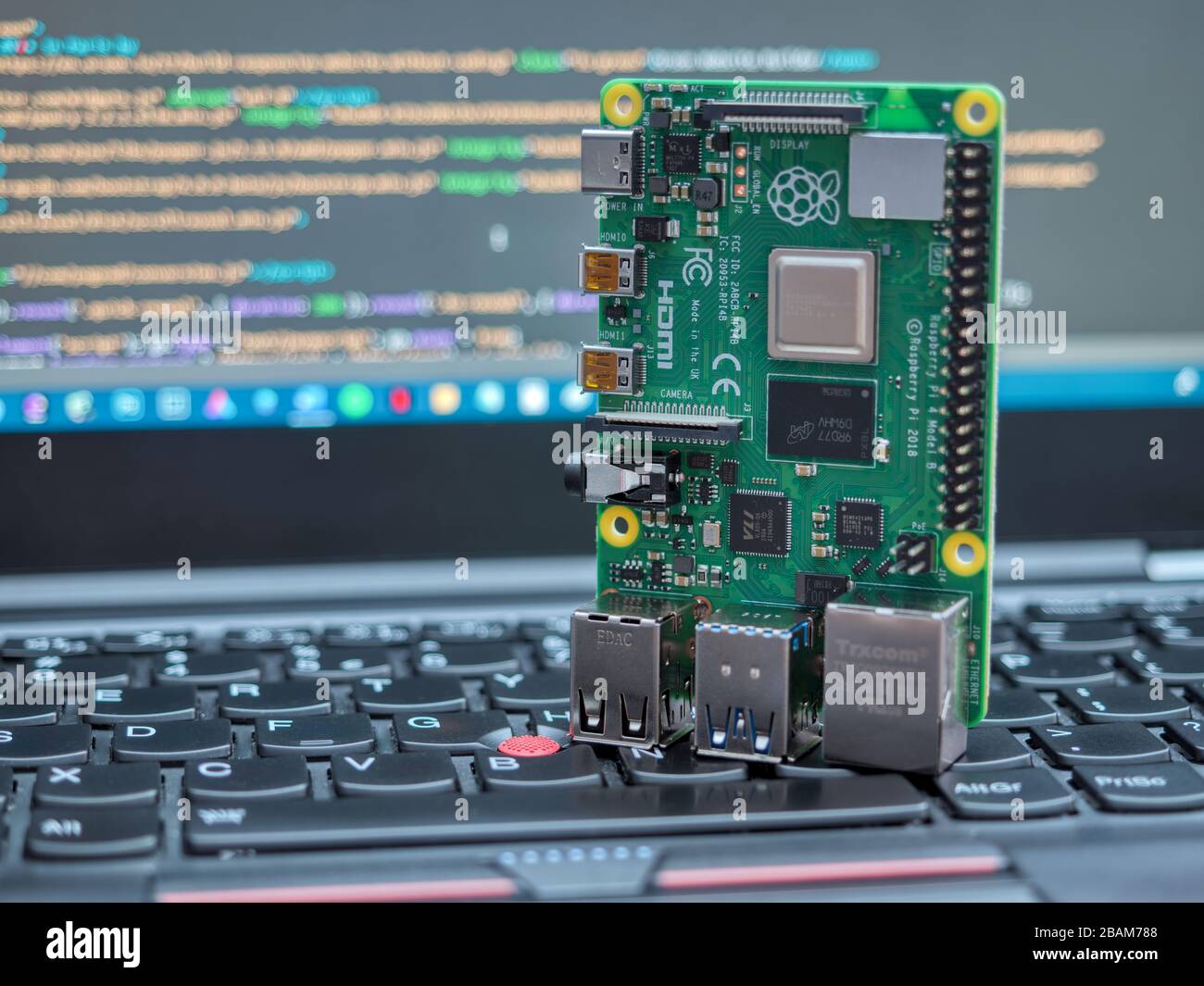 Galati, ROMANIA - March 22, 2020: Close-up of a Raspberry Pi 4 Model-B on a laptop keyboard. The Raspberry Pi is a credit-card-sized single-board comp Stock Photo
