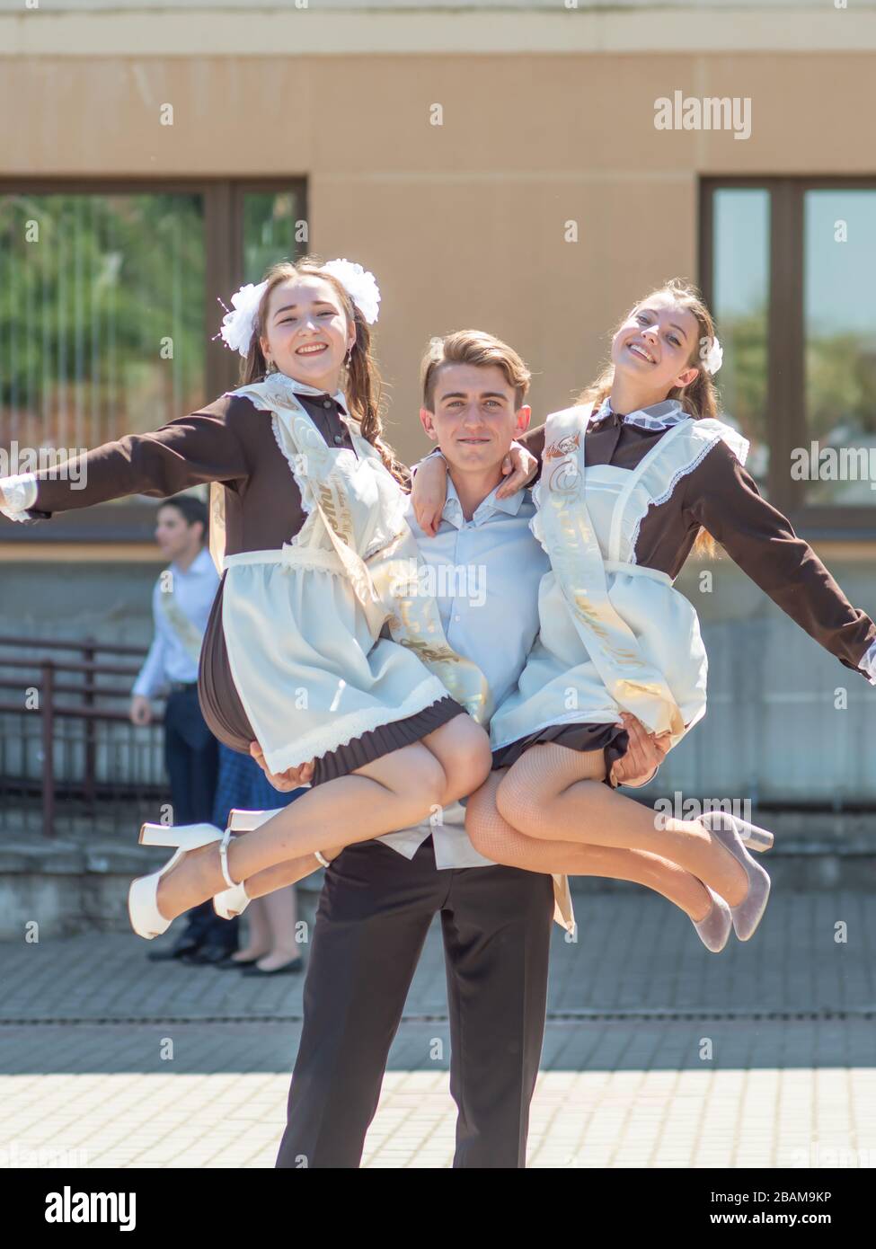 Graduates of the Russian school are photographed on the street Stock ...