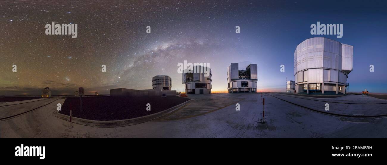 'English: This panoramic view of ESO’s flagship facility in northern Chile was taken by ESO Photo Ambassador Gabriel Brammer. The Very Large Telescope (VLT) is seen setting to work at ESO’s Paranal Observatory, visible against a backdrop of clear skies with the Milky Way overhead. To create this picture, Brammer combined several long-exposure shots in order to capture the faint light of the Milky Way as it circled above the massive enclosures of the VLT’s Unit Telescopes. Each of these giants is 25 metres tall, and they are named after prominent features of the sky in the language of the local Stock Photo