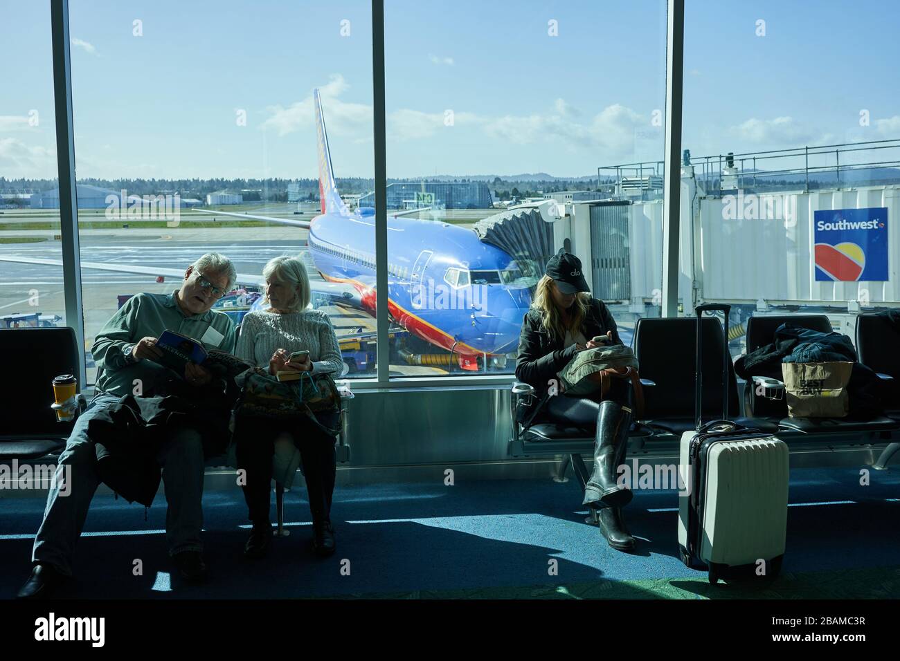 Passengers waiting to board a Southwest Airlines flight at the gate in the terminal building in Portland International Airport on Sunday, Feb 23, 2020. Stock Photo