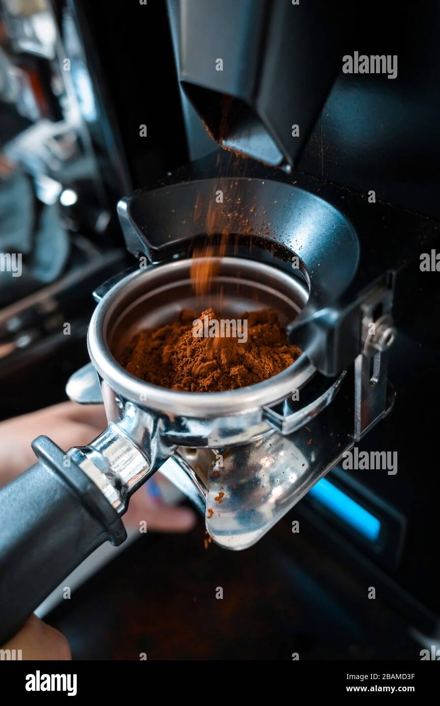 https://c8.alamy.com/comp/2BAMD3F/barista-making-an-espresso-coffee-with-tamper-2BAMD3F.jpg