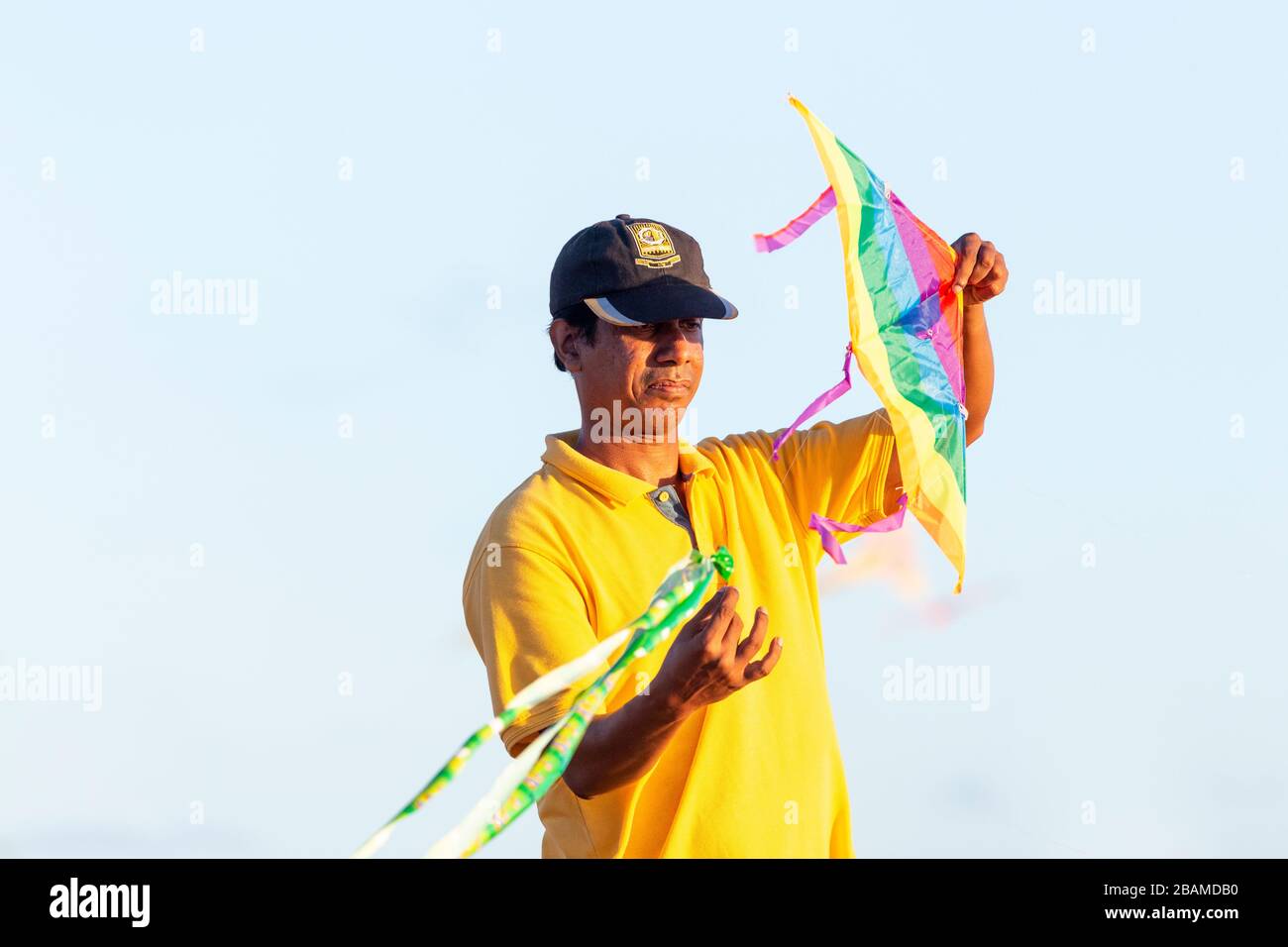 Local man preparing to fly a kite at Galle Face Green in Colombo, Sri Lanka Stock Photo