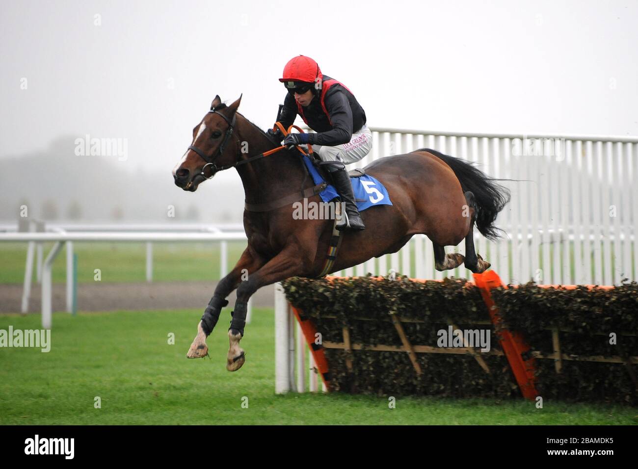 First Avenue ridden by Leighton Aspell jumps the fence on his way to winning the William Hill Hurdle Stock Photo