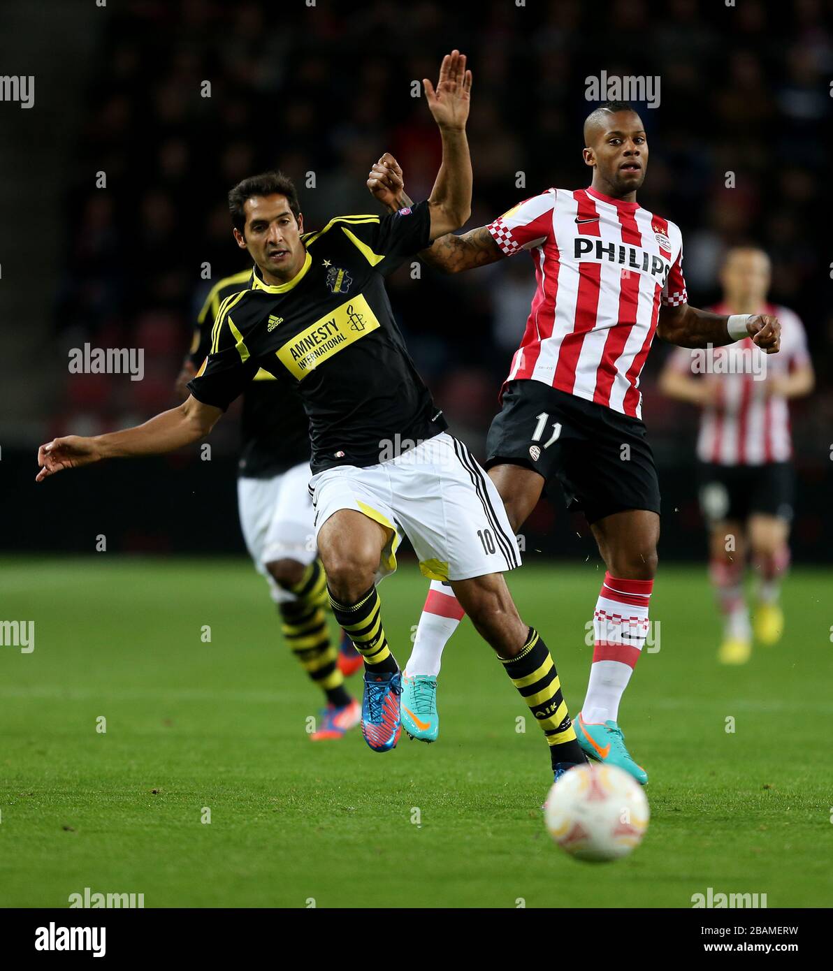 PSV Eindhoven's Jeremain Lens and AIK's Celso Borges Stock Photo