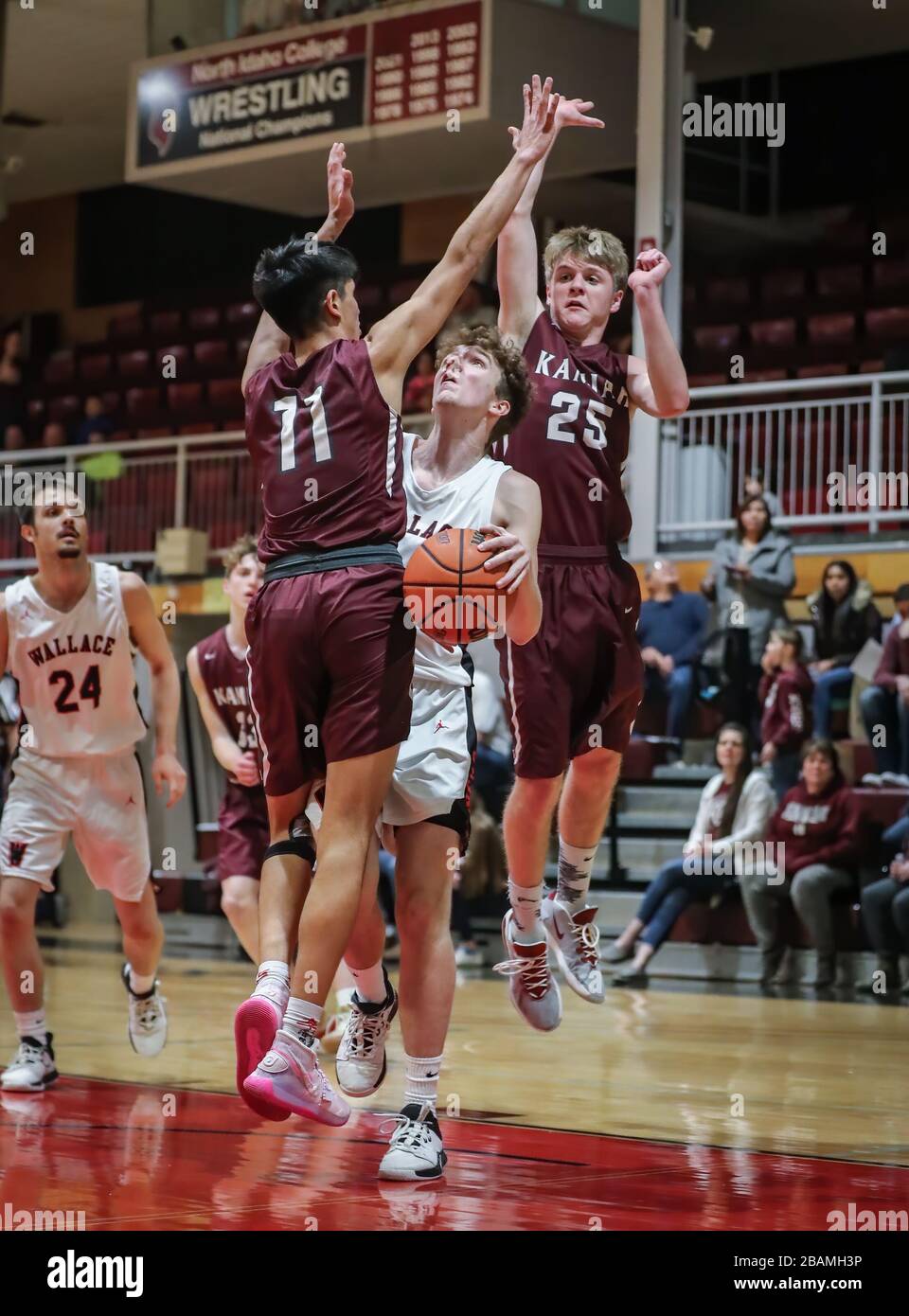 Basketball action with Wallace vs Kamiah High School in Coer d'Alene