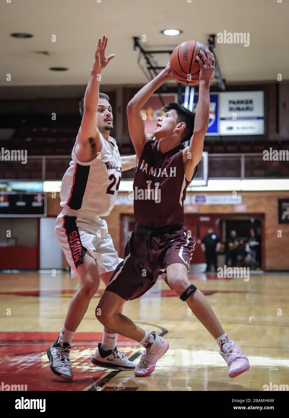 Basketball action with Wallace vs Kamiah High School in Coer d'Alene
