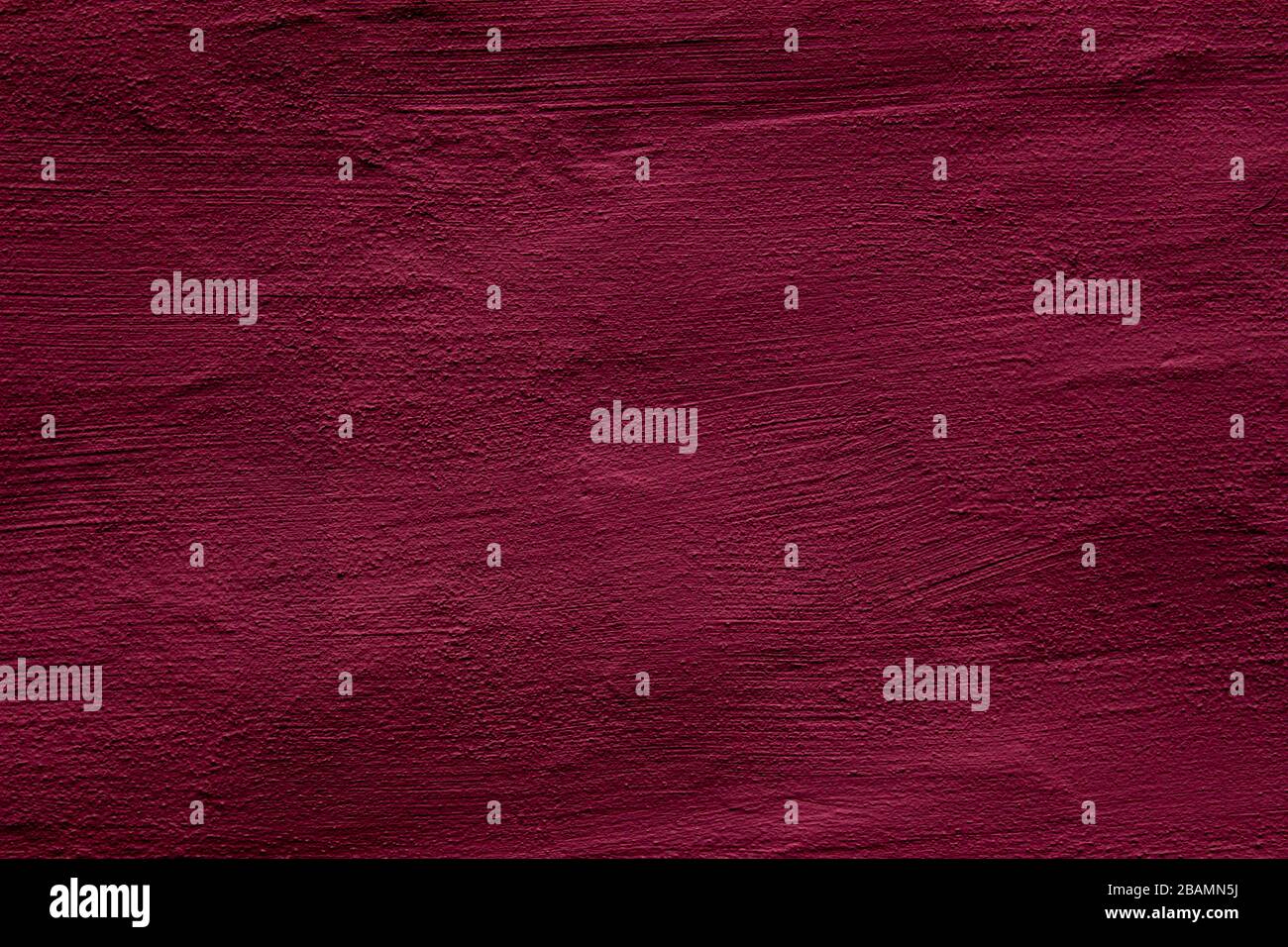Crimson colored abstract wall background with textures of different