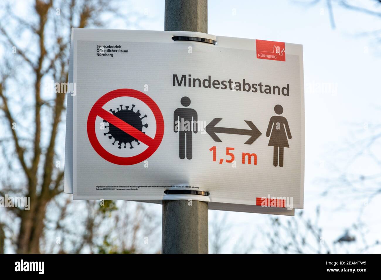 NUERNBERG, GERMANY - March 27, 2020: Sign in German about keeping a minimum of 1.5m distance due to the Corona Virus Stock Photo