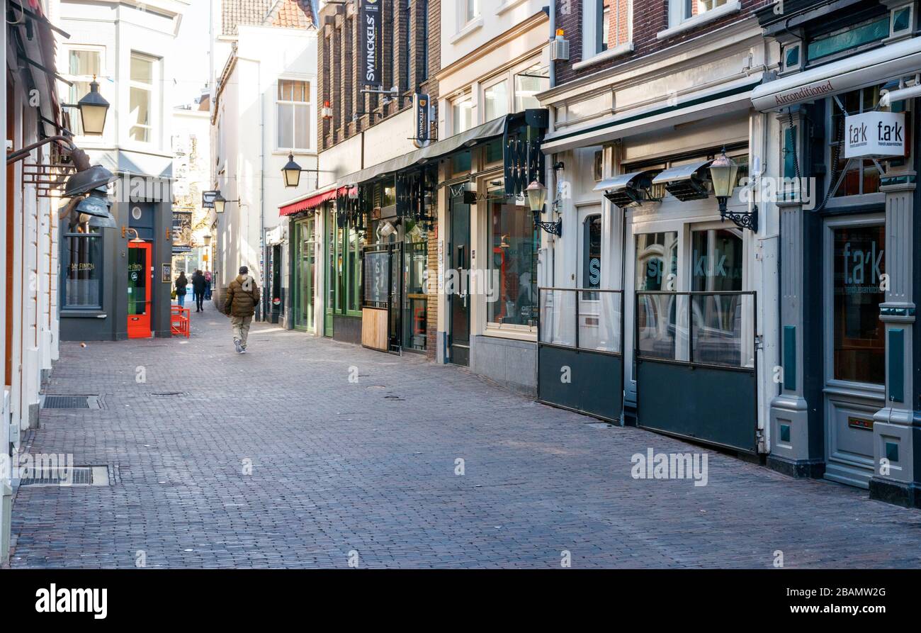 Bars and restaurants at a deserted Drieharingstraat. All bars and restaurants are closed due to the COVID-19 pandemic. Utrecht, The Netherlands. Stock Photo