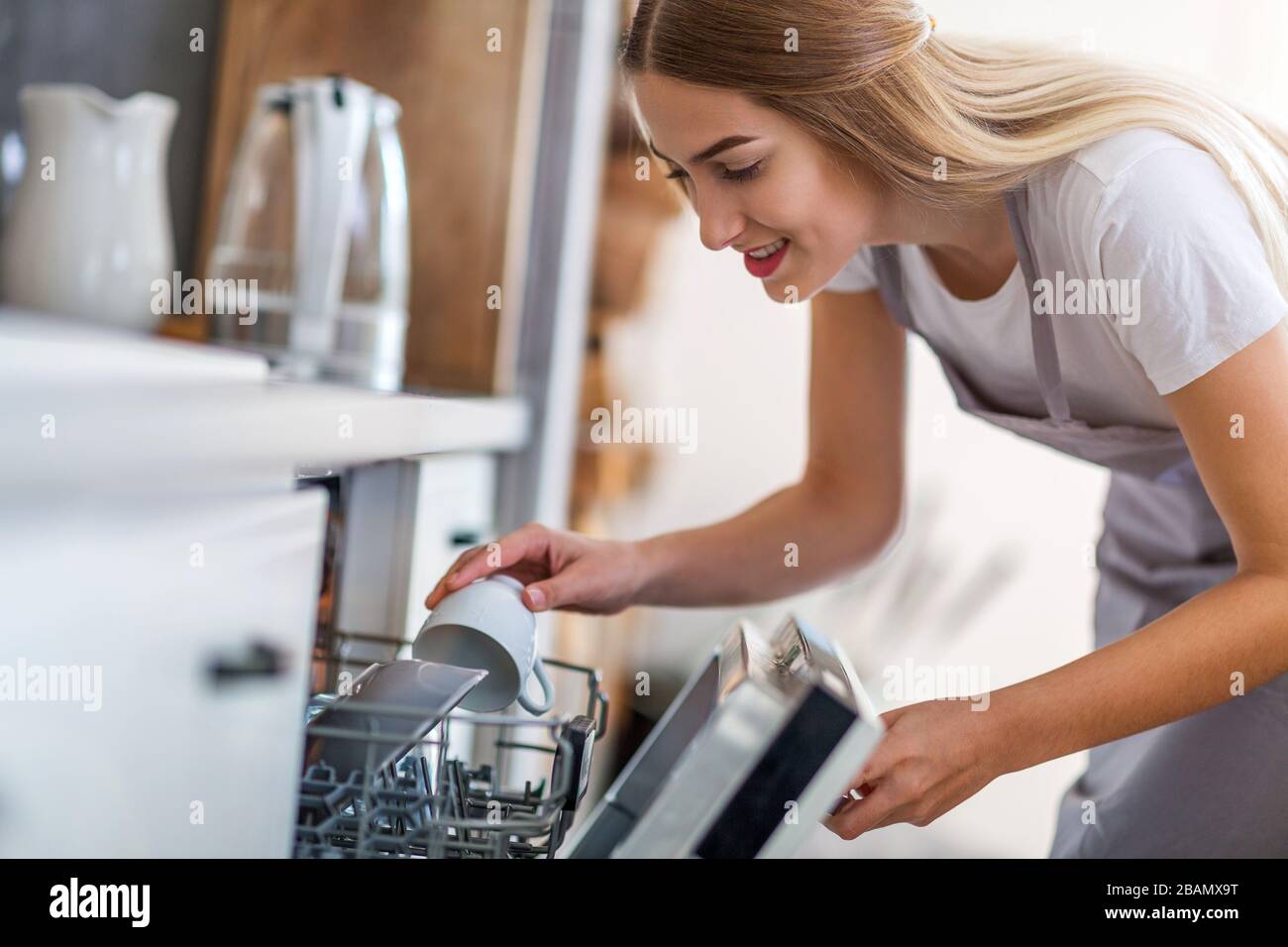 Young woman in the kitchen Stock Photo