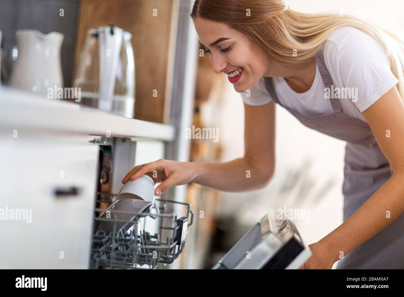Young woman in the kitchen Stock Photo