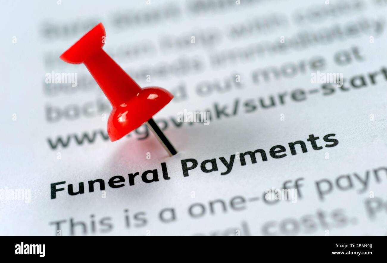 GOVERNMENT FUNERAL PAYMENTS LITERATURE WITH NOTICE BOARD PIN RE DEATH FUNERALS CORONAVIRUS  COVID 19 COSTS ETC UK Stock Photo