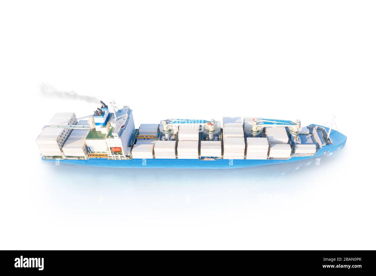 Large full loaded container ship with cranes sailing bright blue sea. Isolated on white, clipping path included Stock Photo
