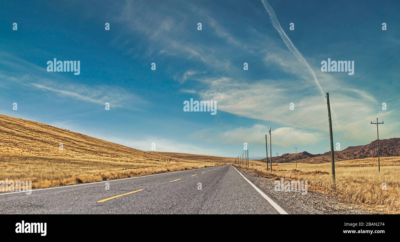 Long road surrounded high hi-res stock photography and images - Alamy