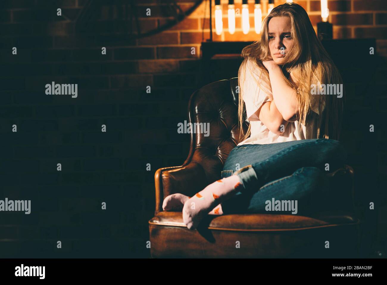 Woman crying alone dark room hires stock photography and images Alamy