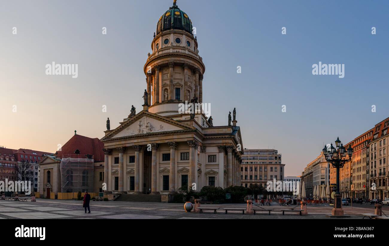 Berlin, Germany - March 28, 2020 - French Cathedral located at the Gendarmenmarkt at the Corona crisis - A lonely man Stock Photo