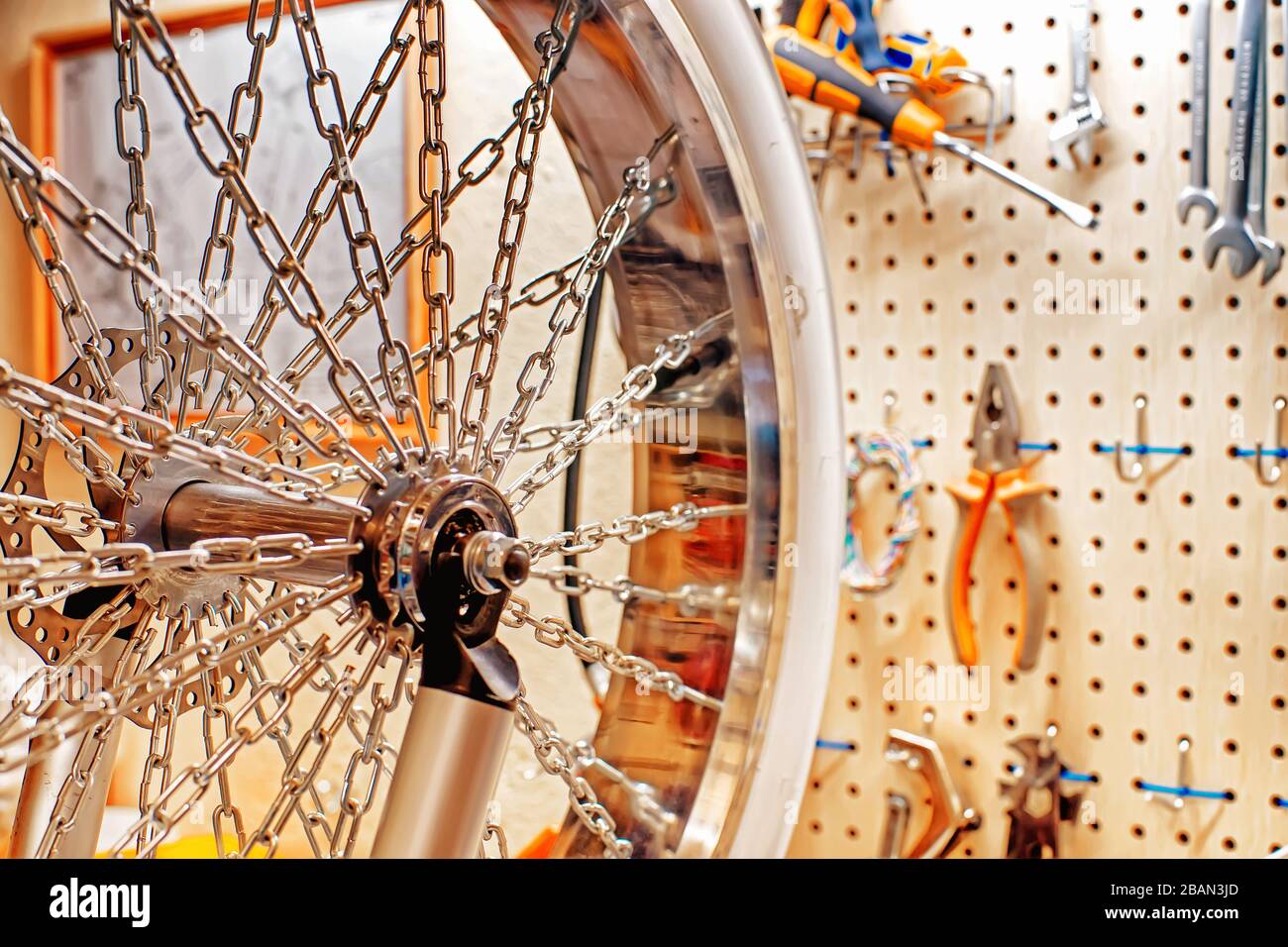 Custom wheel and tools in the bicycle workshop. Selective focus Stock Photo