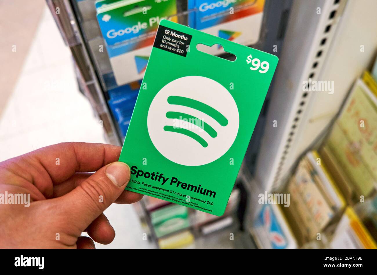 Montreal, Canada - March 24, 2020: Spotify green gift card in a