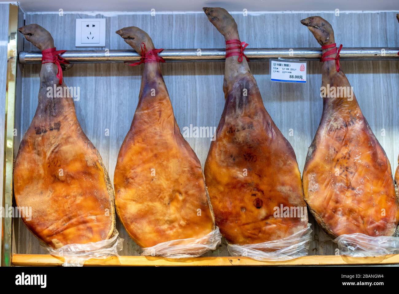 Hams on display for sale at a local market in Shanghai, China Stock Photo