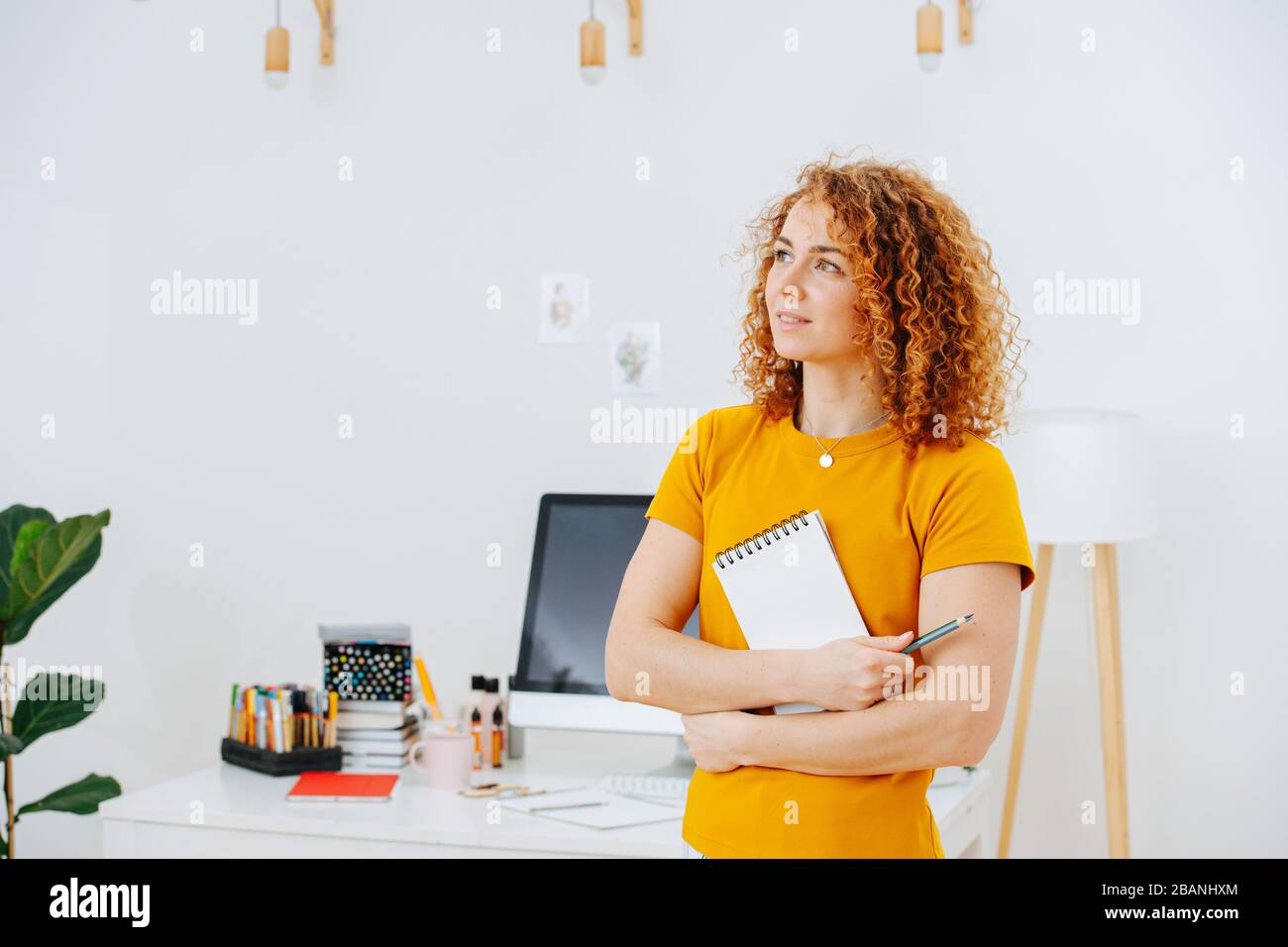 Portrait of thoughtful woman in search of a new idea Stock Photo