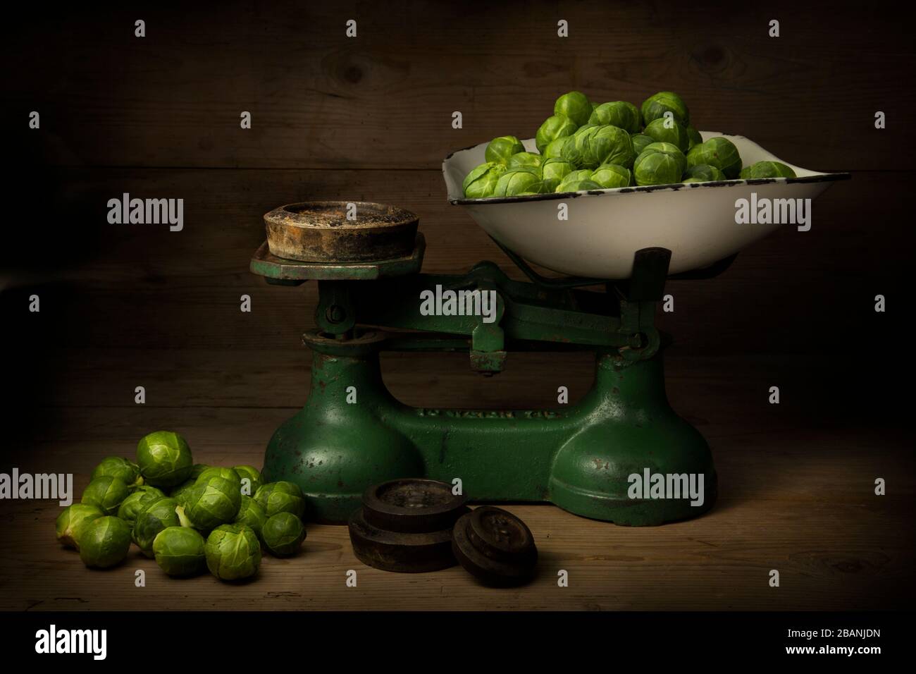 Brussel sprouts on a traditional balance weighing scales. Stock Photo