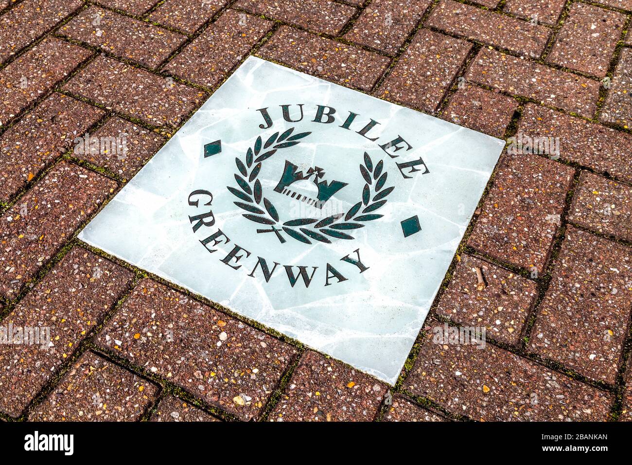 Sign for Jubilee Greenway walking path in the ground, London, UK Stock Photo