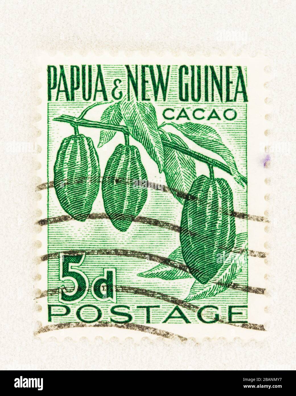 SEATTLE WASHINGTON - March 27, 2020: Close up of used Papua and New Guinea stamp featuring the pods of Cacao on tree. Scott # 141 Stock Photo